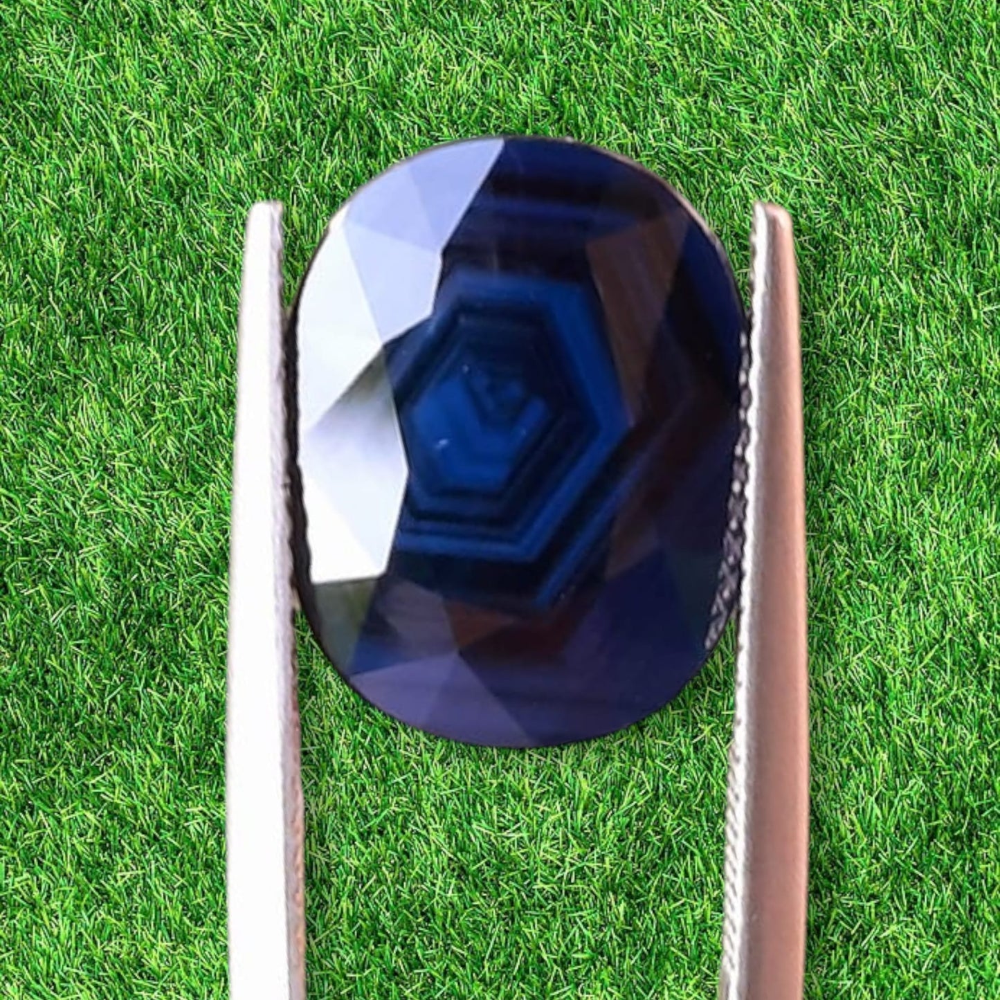 Explore our exclusive 7.82 ct. collectible: a unique, unheated deep, dark blue Sapphire of unparalleled allure.
