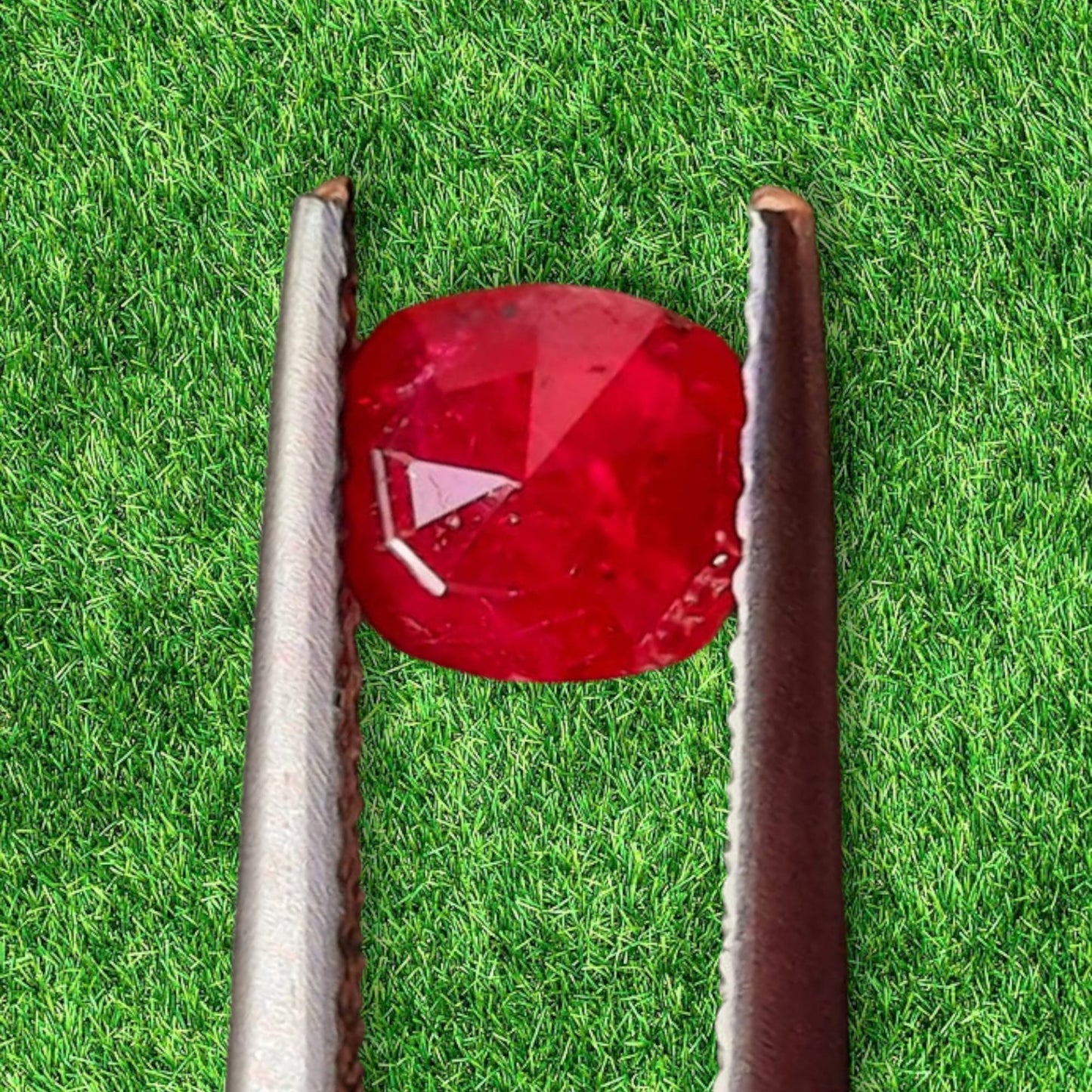 Loose natural unheated 0.86 ct. Kashmir red Ruby with inclusions.